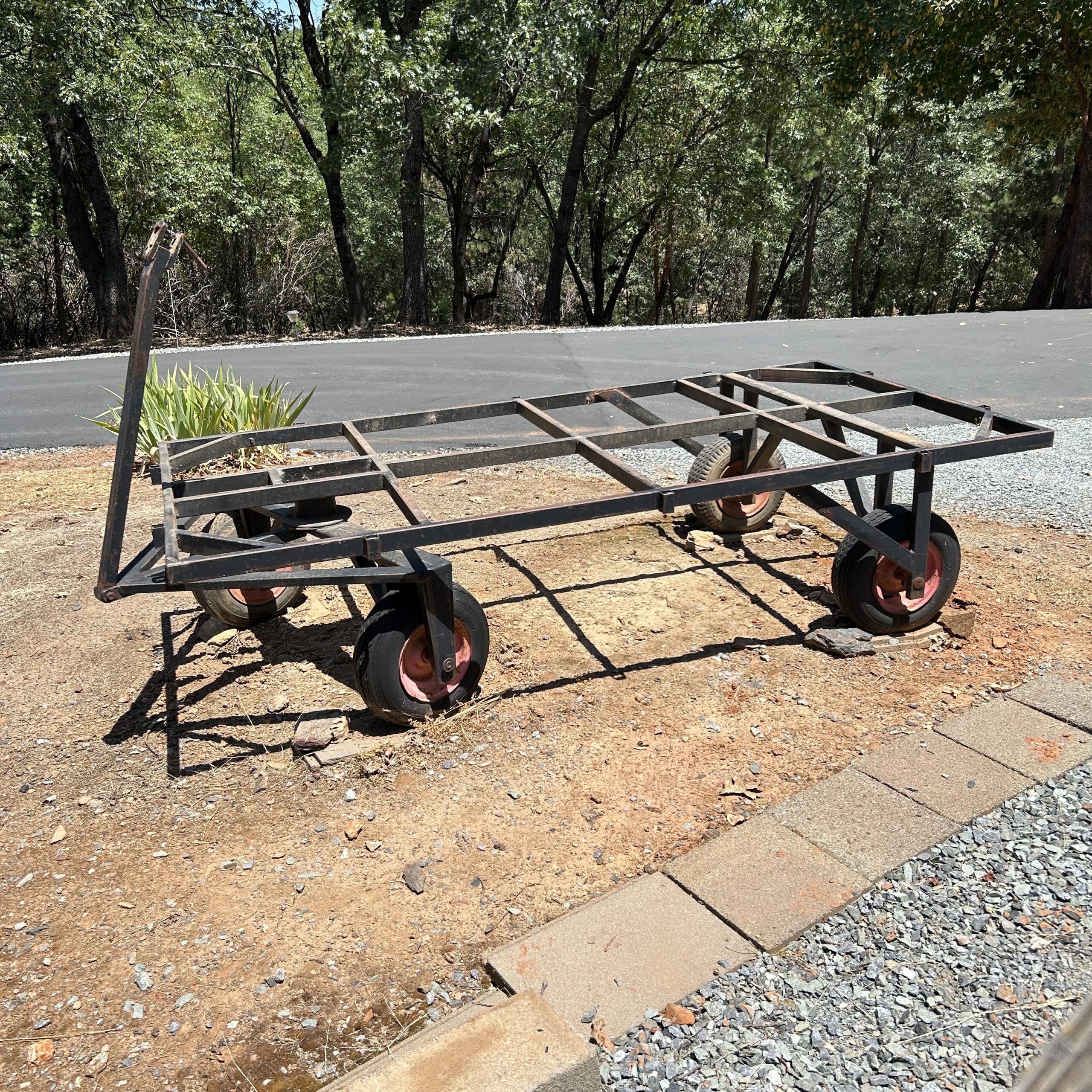 Four-wheel hay wagon photographed before its on-site sale